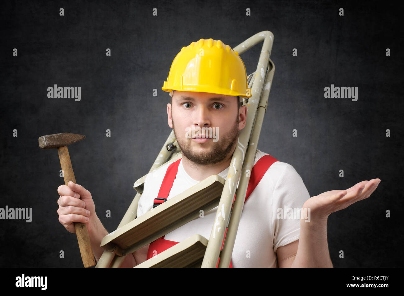 Clumsy worker with tools Stock Photo