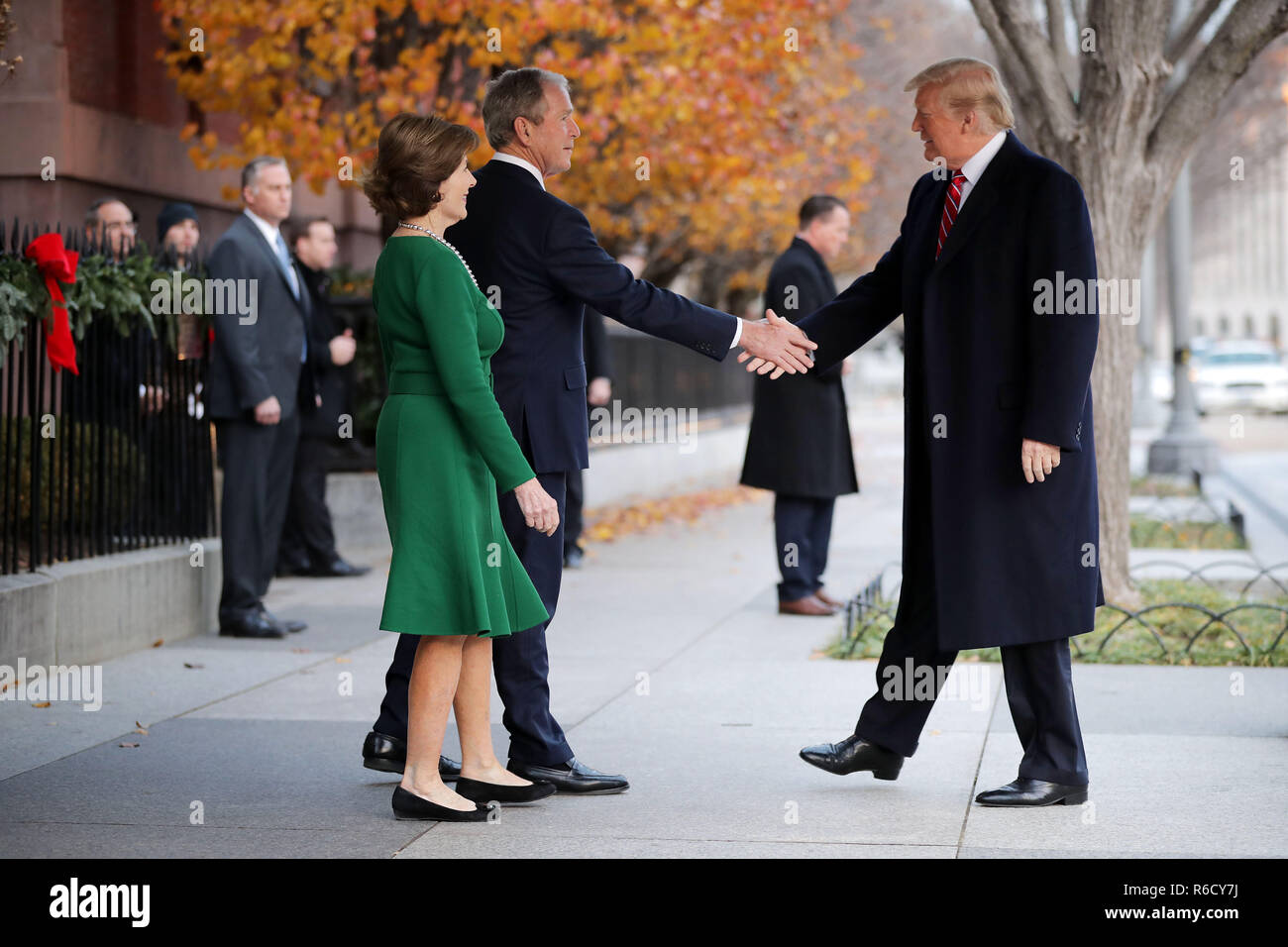 Washington, DC, USA. 04th Dec, 2018. Former first lady Laura Bush and former President George W. Bush greet President Donald Trump outside of Blair House December 04, 2018 in Washington, DC, USA. The Trumps were paying a condolence visit to the Bush family who are in Washington for former President George H.W. Bushs state funeral and related honors. Credit: Chip Somodevilla/Pool via CNP | usage worldwide Credit: dpa/Alamy Live News Stock Photo