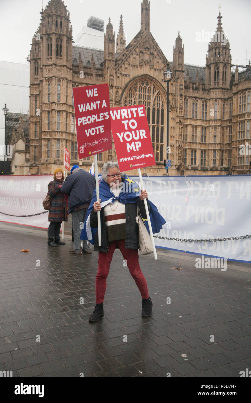London UK. 5th December 2018. A Pro EU protester from SODEM outside Parliament with placards demanding a second referendum a people's vote on leaving the European Union Credit: amer ghazzal/Alamy Live News Stock Photo