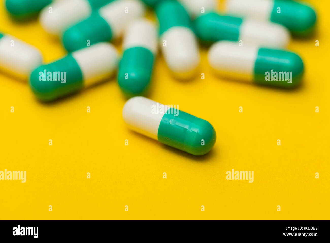 Prescription antibiotic drug medication pills on a bright colourful ...