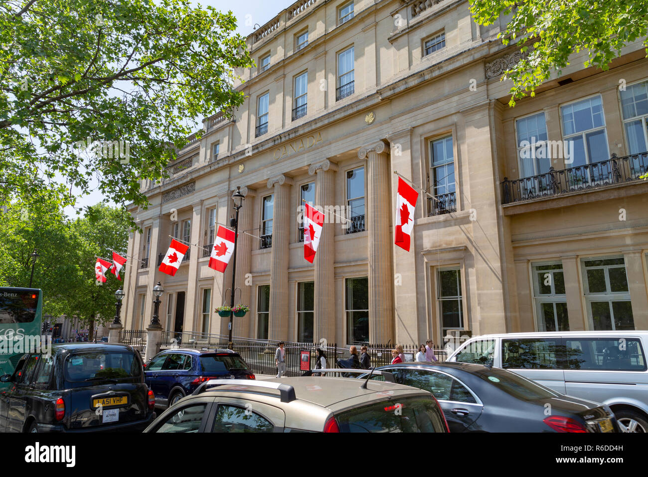 Canada House on Trafalgar Square, City of Westminster, London, the Canadian High Commission, with red and white Canadian national flags flying Stock Photo