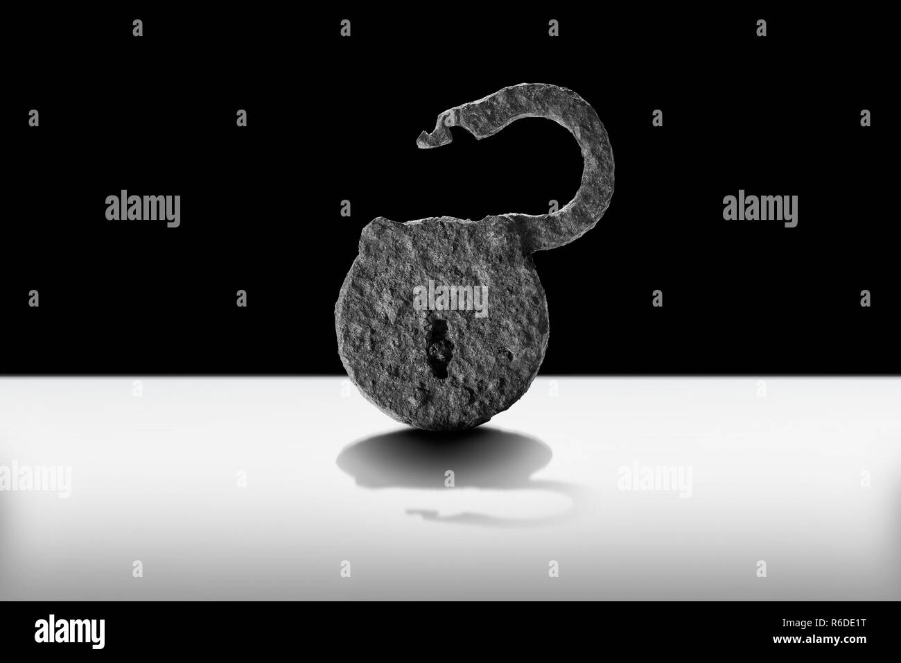 Rusty open metal padlock, monochrome Stock Photo