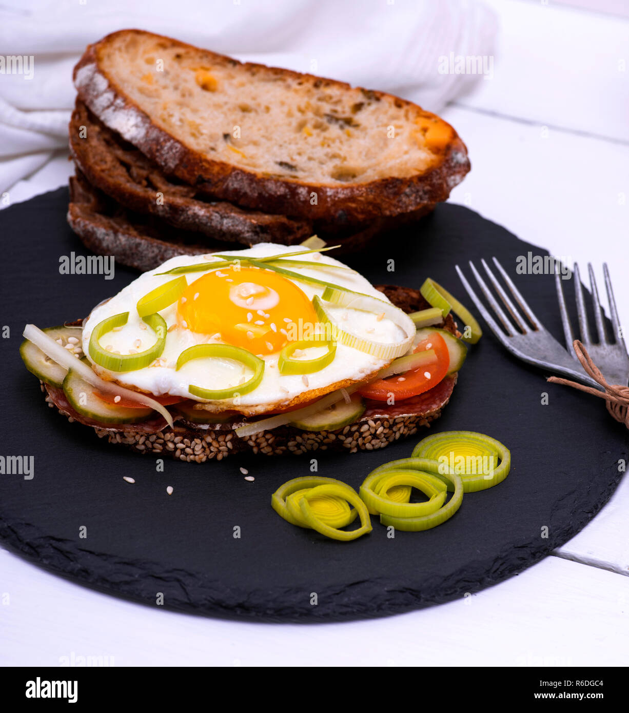 Sandwich with fried egg and a piece of rye bread Stock Photo - Alamy