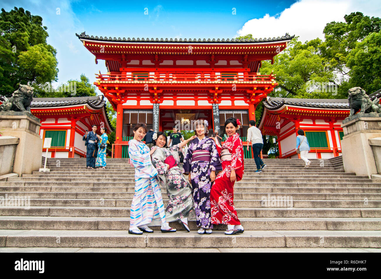 Japanese women wearing traditional kimono during cherry blossom season at historic Kiyomizu Temple in Kyoto, Japan