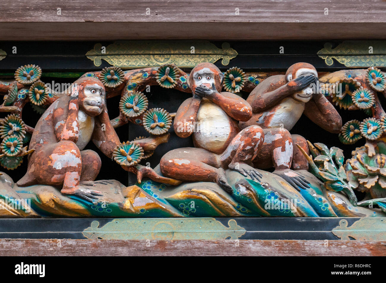 Famous Wood Carvings See No Evil, Speak No Evil And Hear No Evil Of The Three Wise Monkeys At Tosho-Gu Wood Carvings At A Store House In Nikko Tosgogu Stock Photo