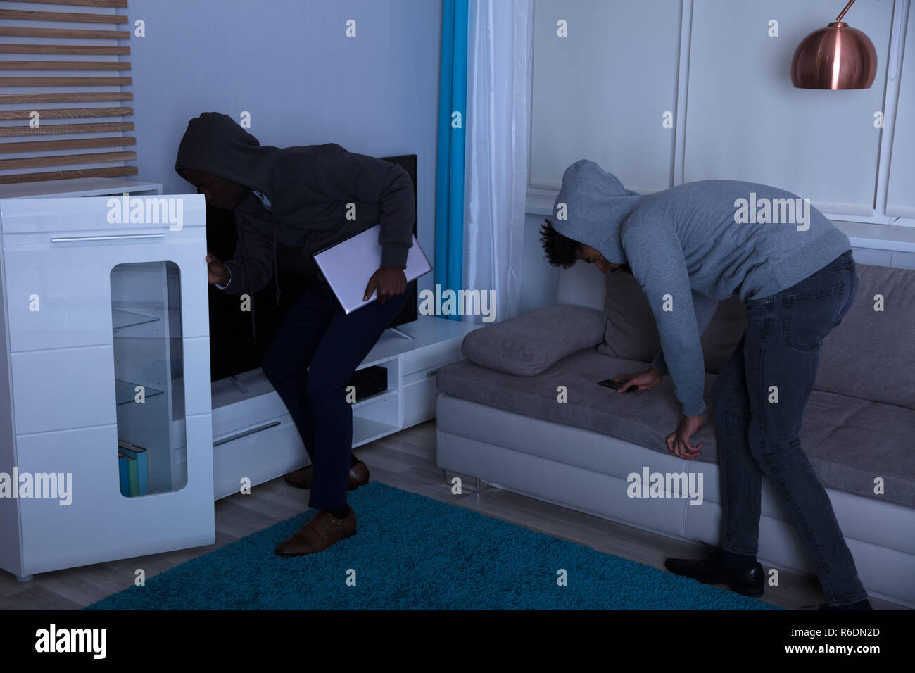 Two Burglar Stealing Things In The House At Night Stock Photo Alamy