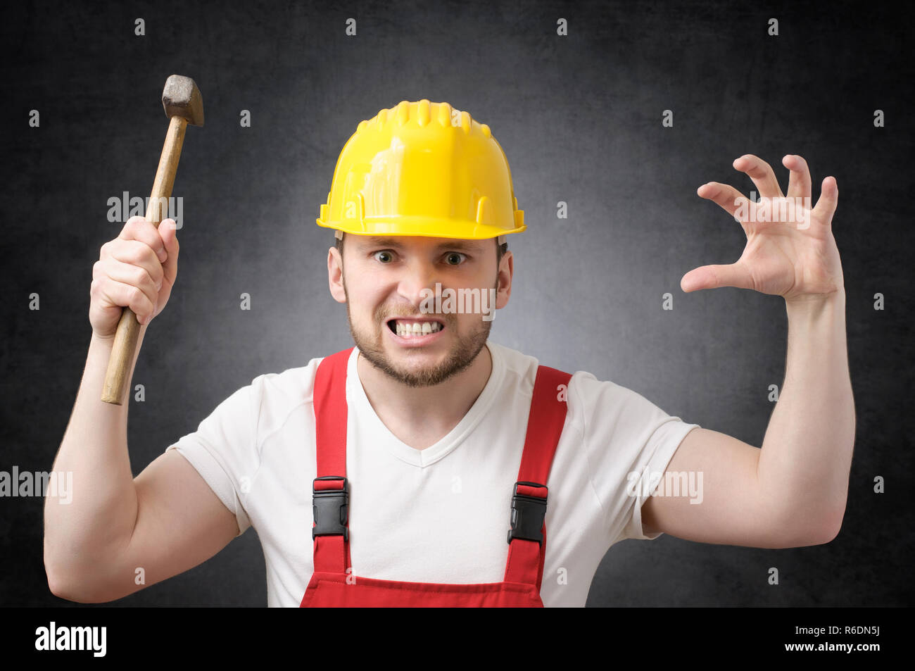 Construction worker with hammer Stock Photo - Alamy
