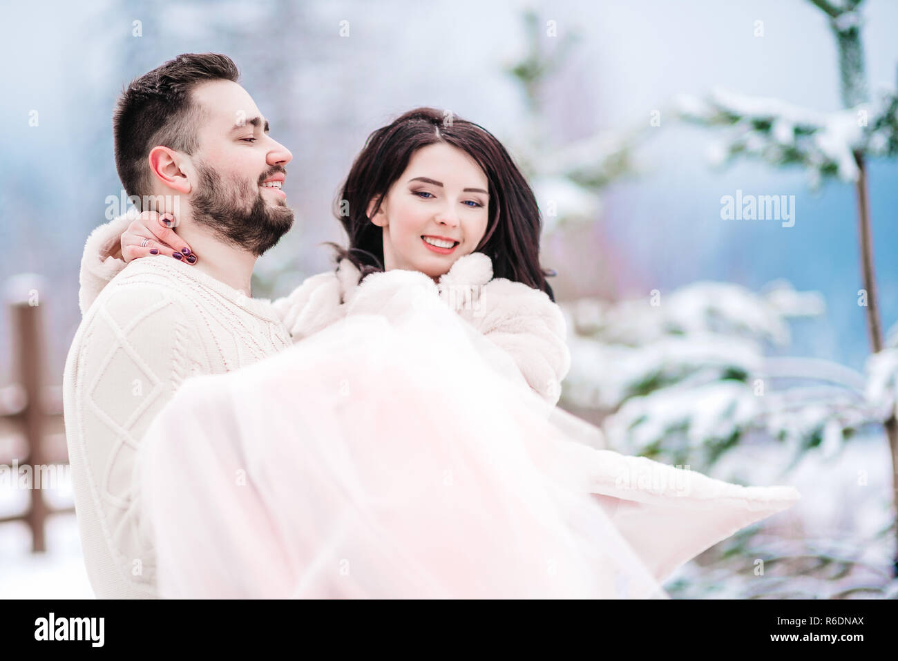 young couple on a walk in the snowy mountains Stock Photo - Alamy