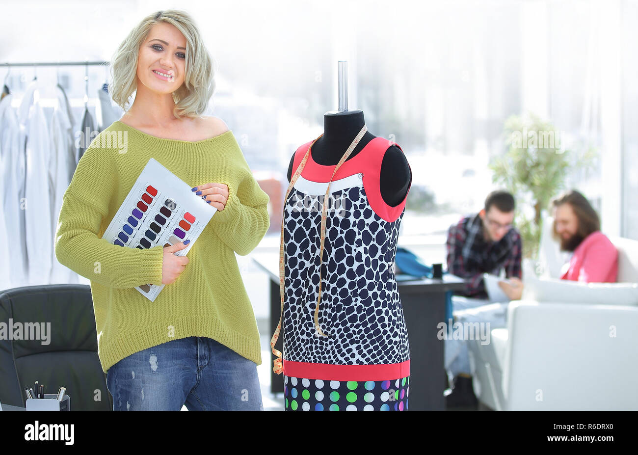 female fashion designer with the fabric samples for the new collection