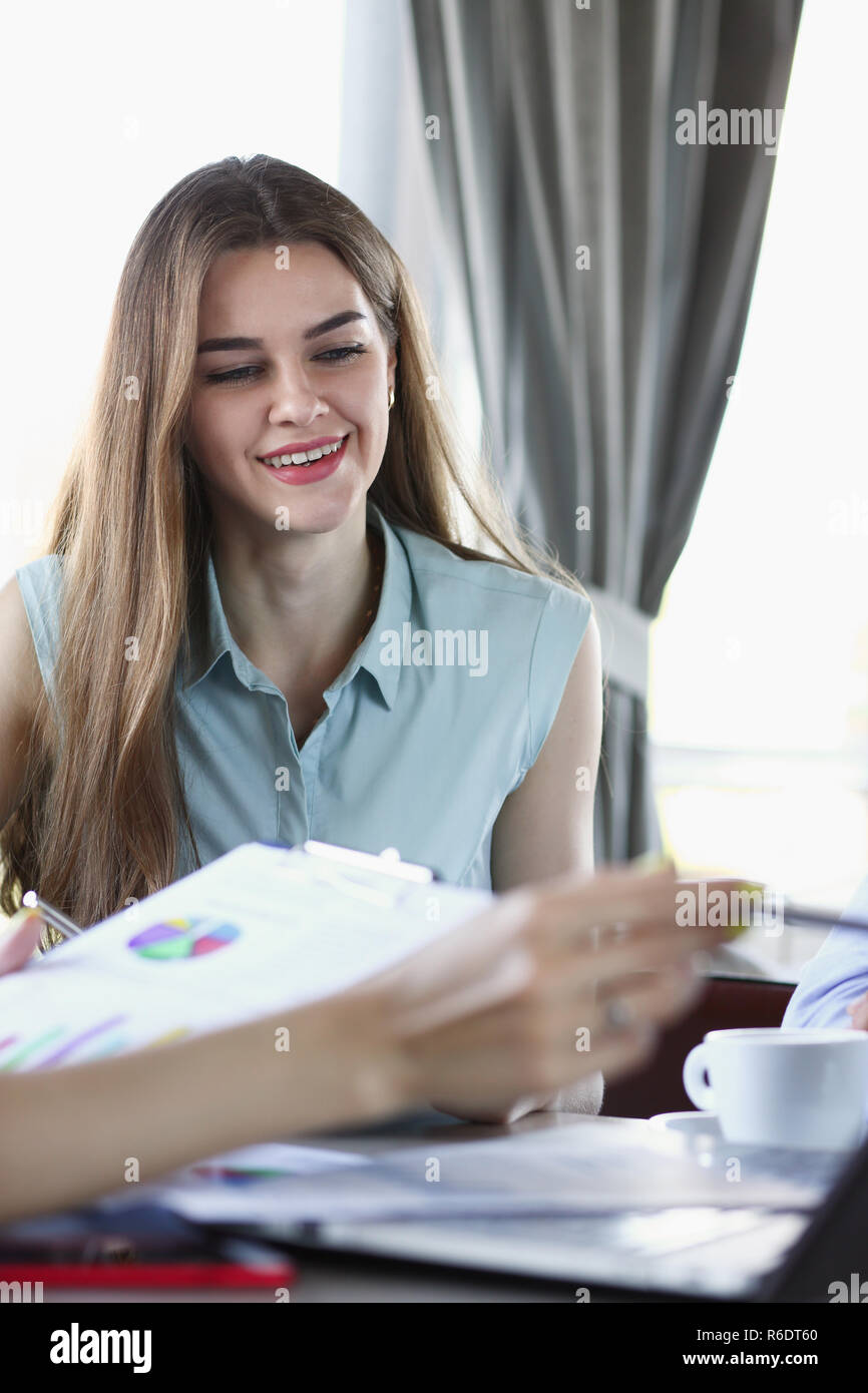 Two business women communicate in a cafe Stock Photo - Alamy