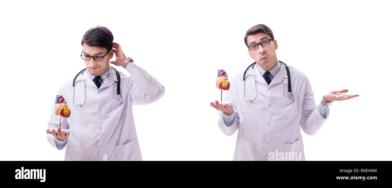 Young doctor with heart shape isolated on white Stock Photo - Alamy