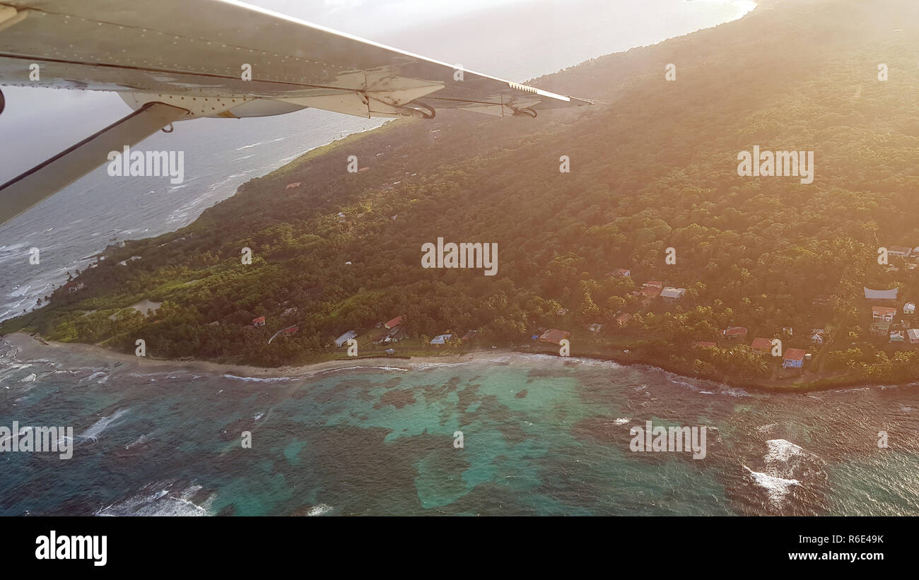 Travel to island on plane theme. Tropical coastline Stock Photo
