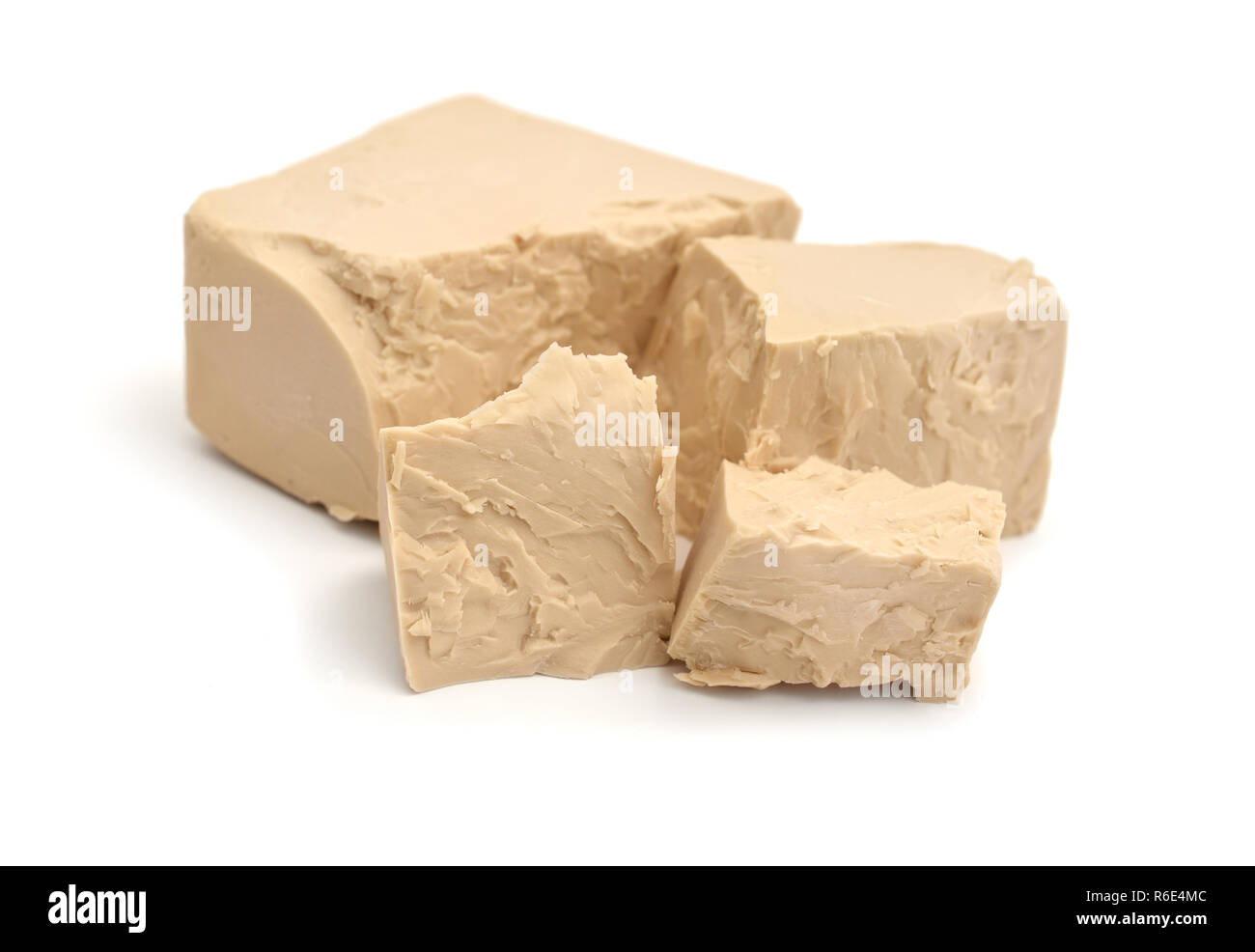 A block of compressed fresh yeast isolated. Stock Photo