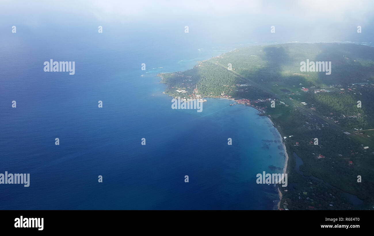 Big island on blue ocean background. Air travel theme Stock Photo