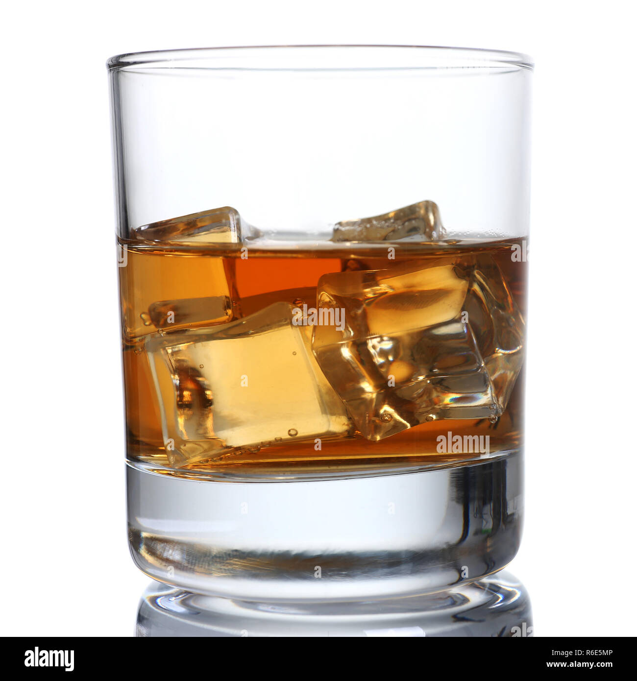 Whiskey with ice in a glass isolated Stock Photo Alamy