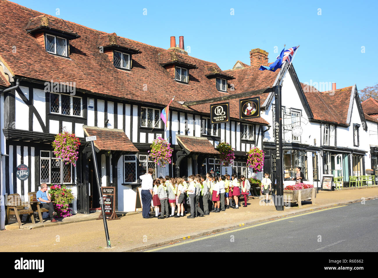 School children group at 16th century Queens Head Inn, High Street