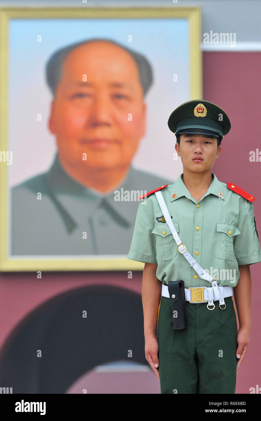 A Soldier Guards In Front Of The Main Entrance Of Tiananmen Gate With Mao Zedong Portrait At Backgrounds, Beijing, China Stock Photo