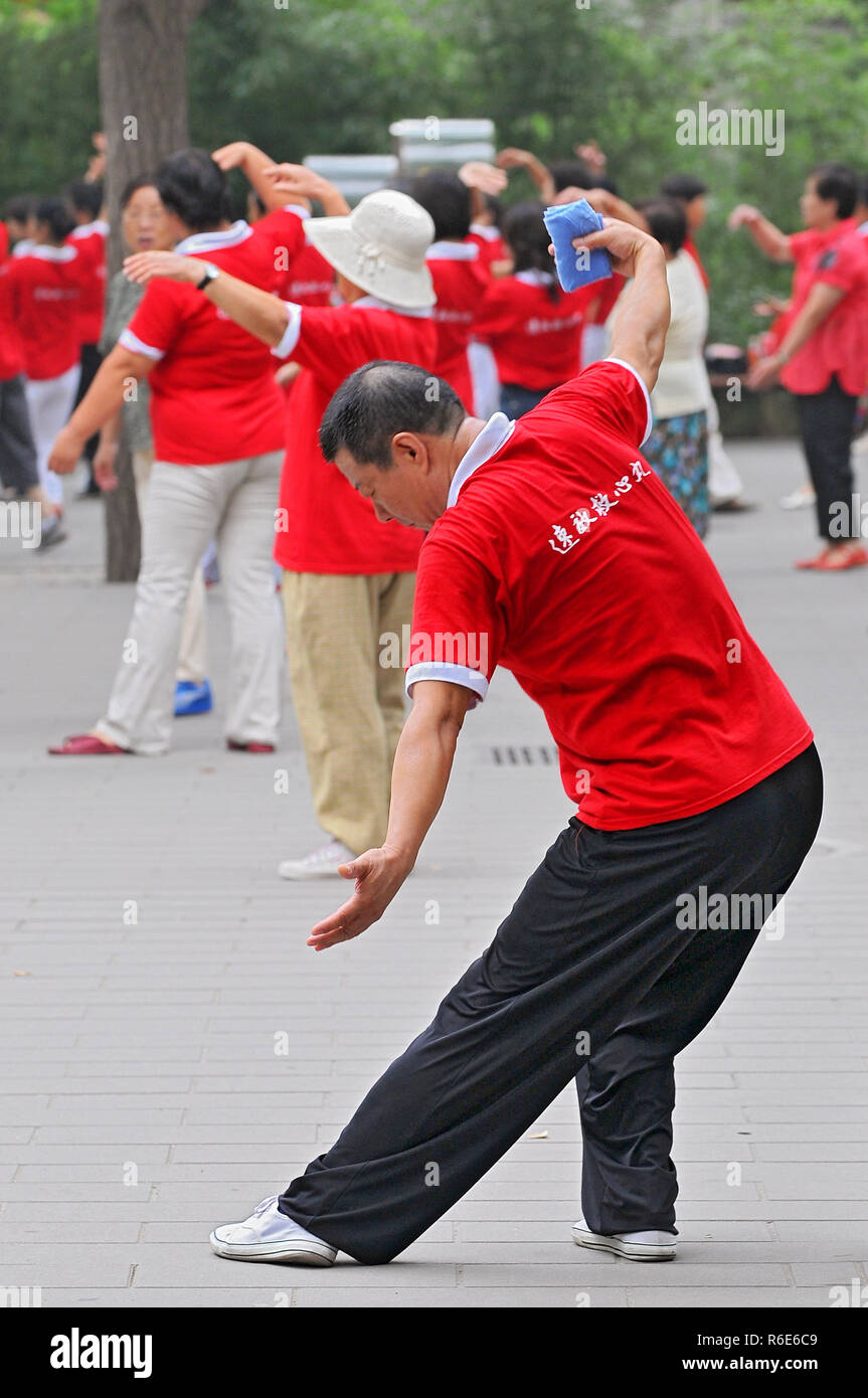 People Practices Traditional Gymnastics In Jingshan Park In Beijing, China Stock Photo