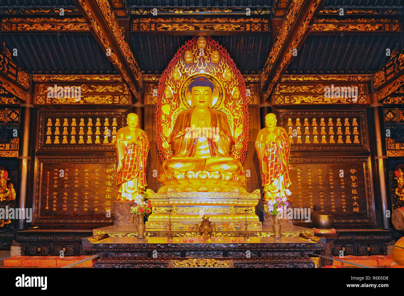 The Golden Statue Of The Buddha And Two Monks Of The Da Ci'En Temple, Xian, China Stock Photo