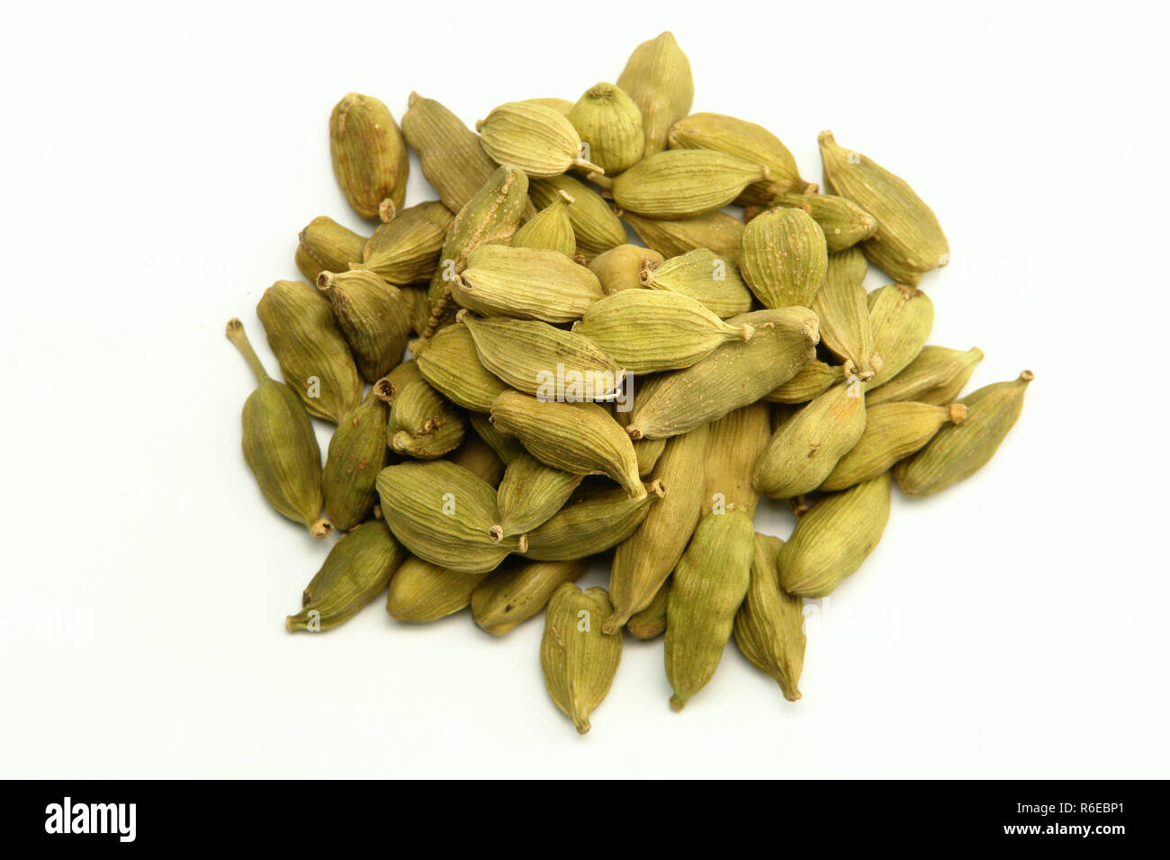 Green cardamom spice on white background Stock Photo