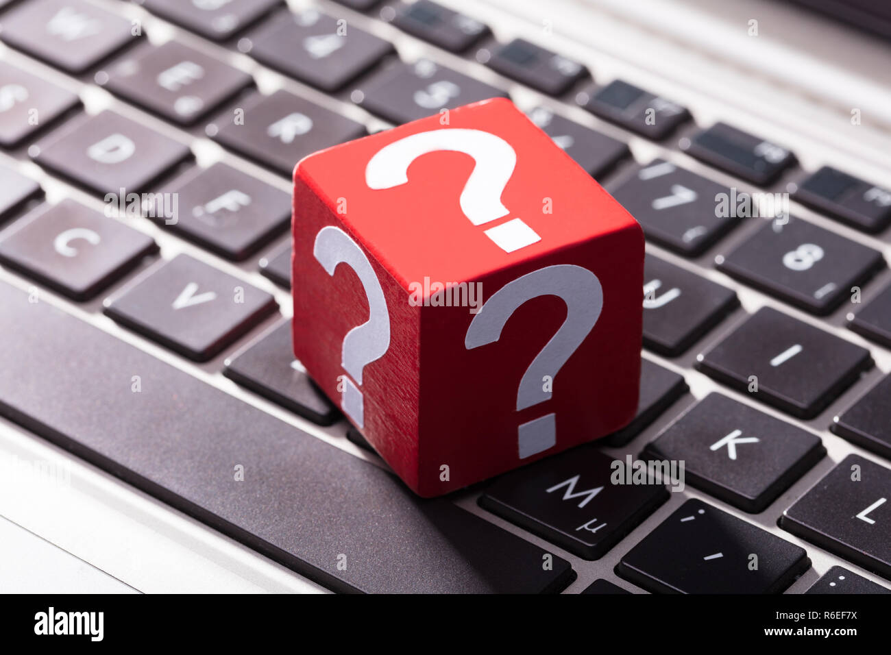 Question Mark Red Block Over The Laptop Keypad Stock Photo Alamy