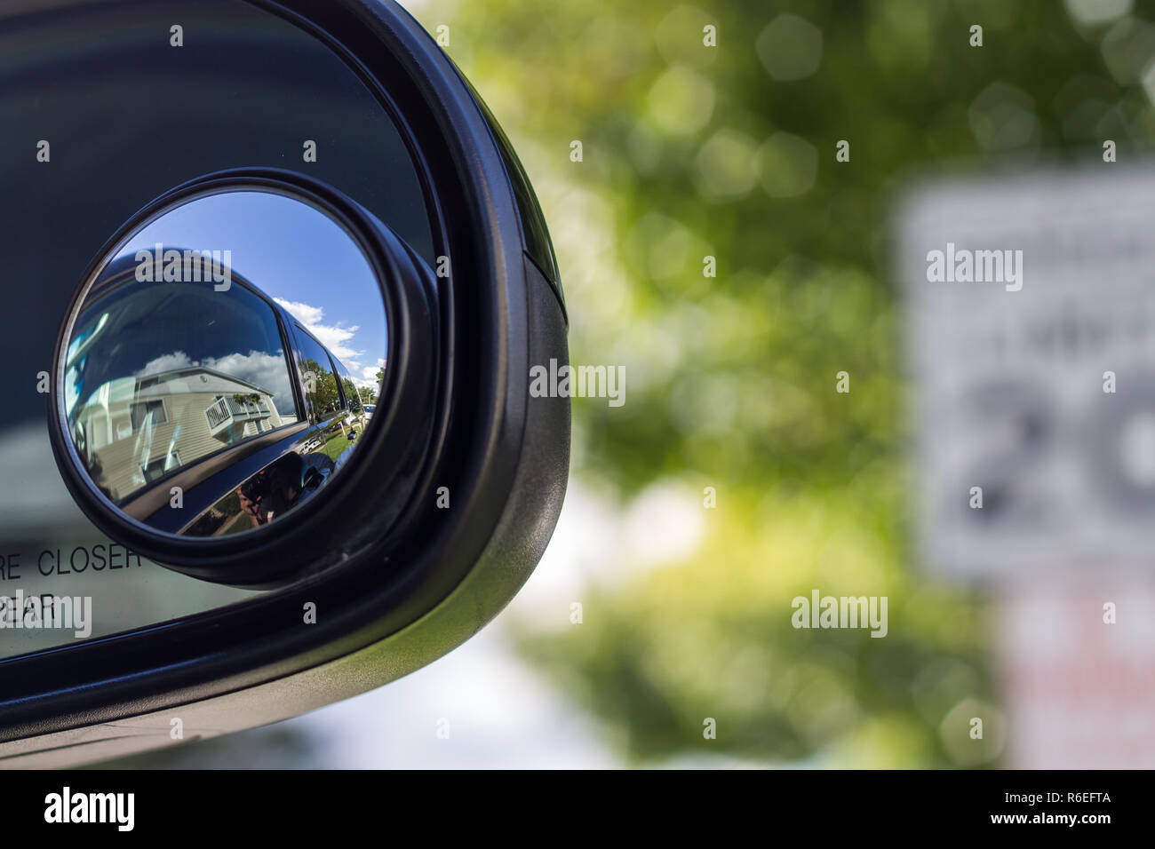 Close up of a blind spot mirror on the passenger side Stock Photo