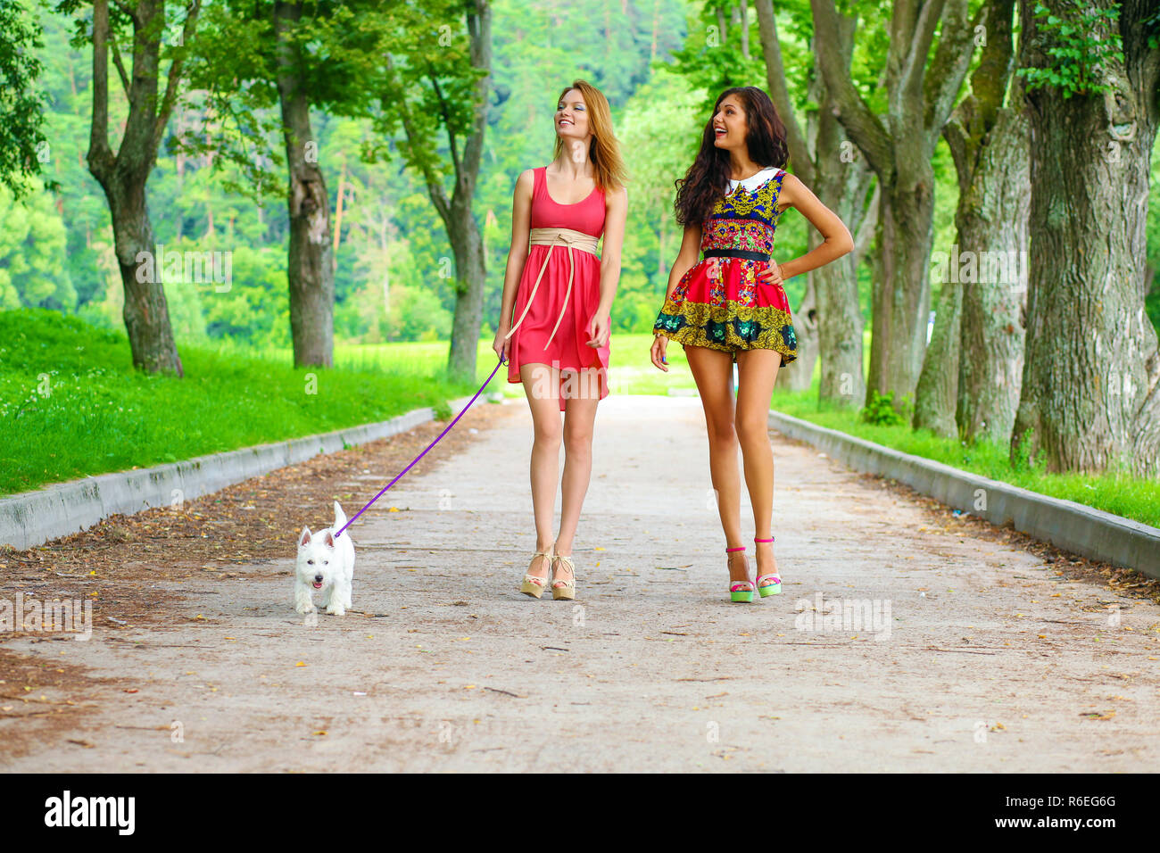 Happy women walking hi-res stock photography and images - Alamy