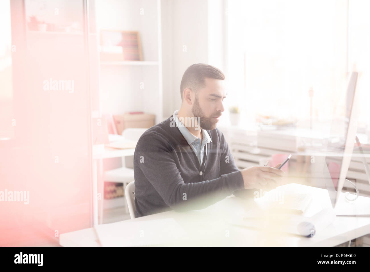 Office Worker Using Smartphone Stock Photo