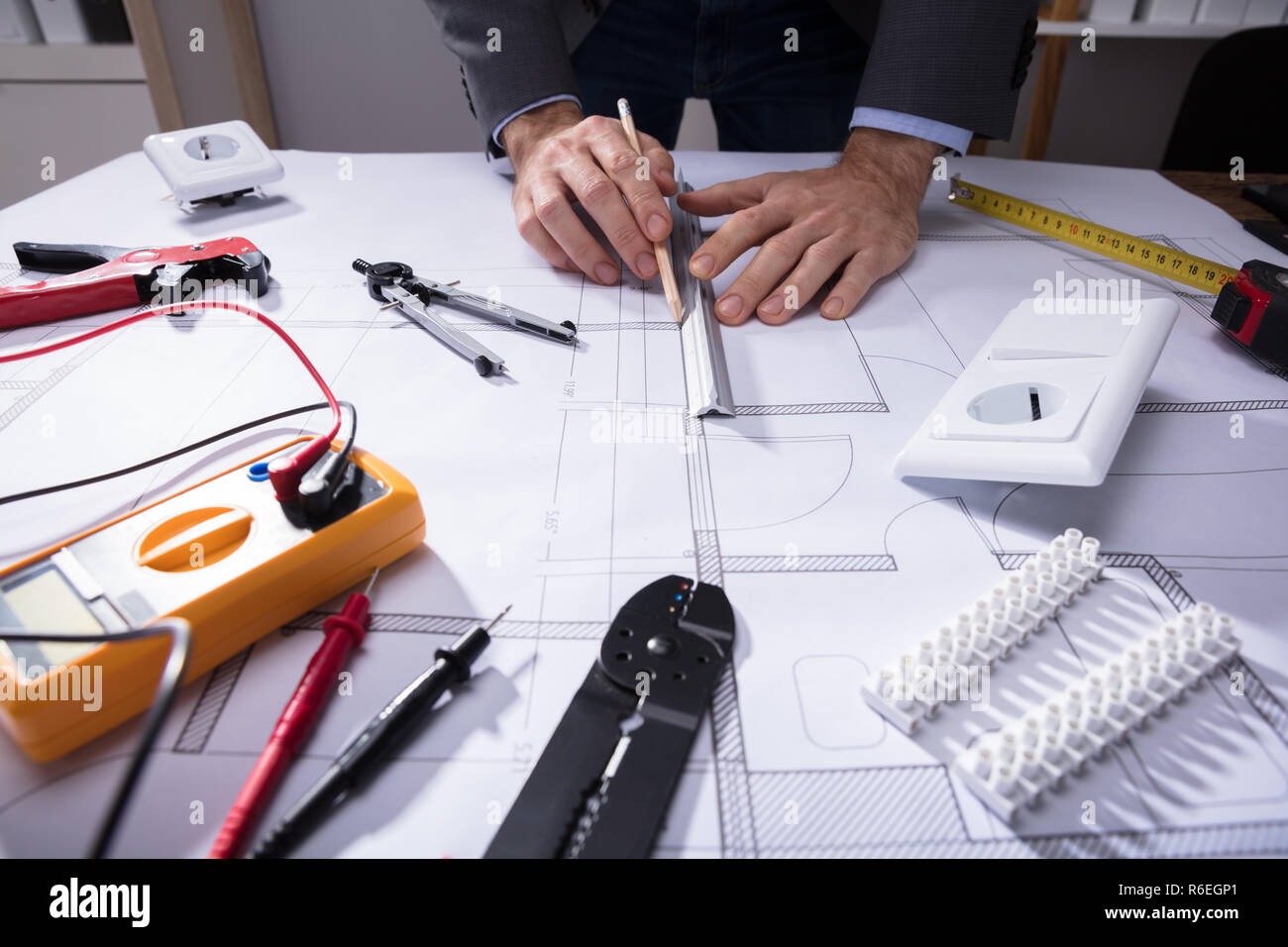 Architect Using Pencil To Draw Blueprint Stock Photo Alamy