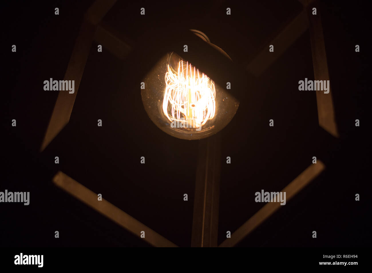 Lightbulb with square ceiling lamp Stock Photo
