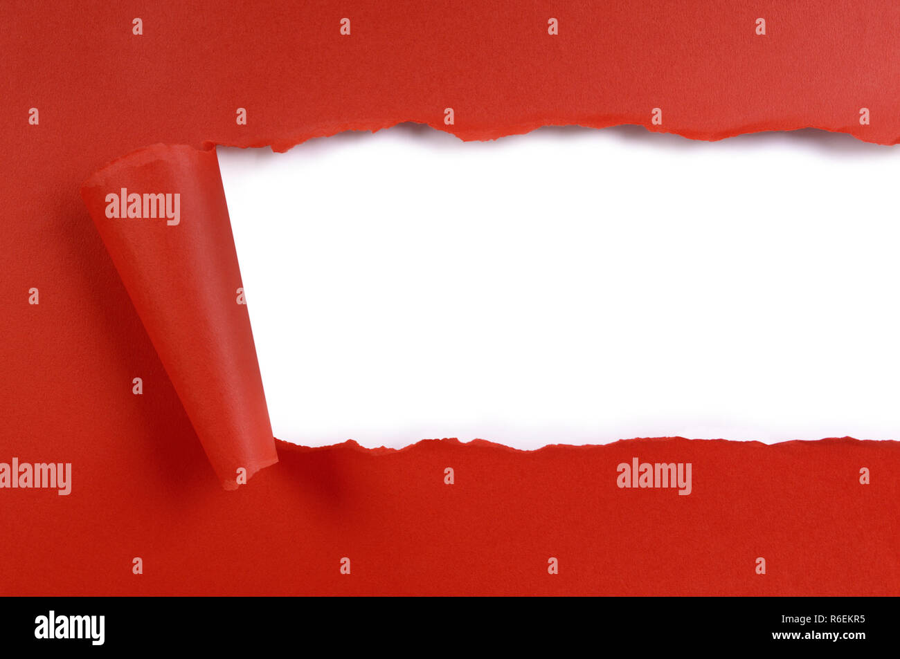 Torn strip red craft paper, white background, copy space Stock Photo
