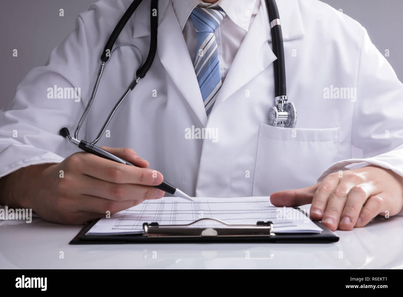 Man doctor stethoscope forms hi-res stock photography and images - Alamy