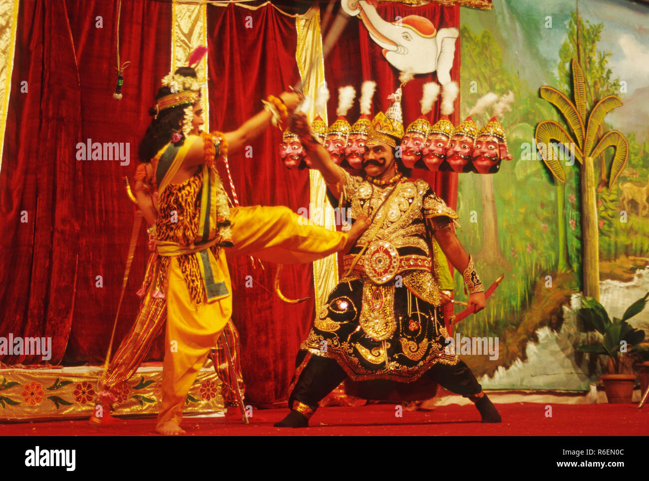 ramleela mythology play ramayan on stage showing lord rama and demon ravana ten heads fighting india Stock Photo