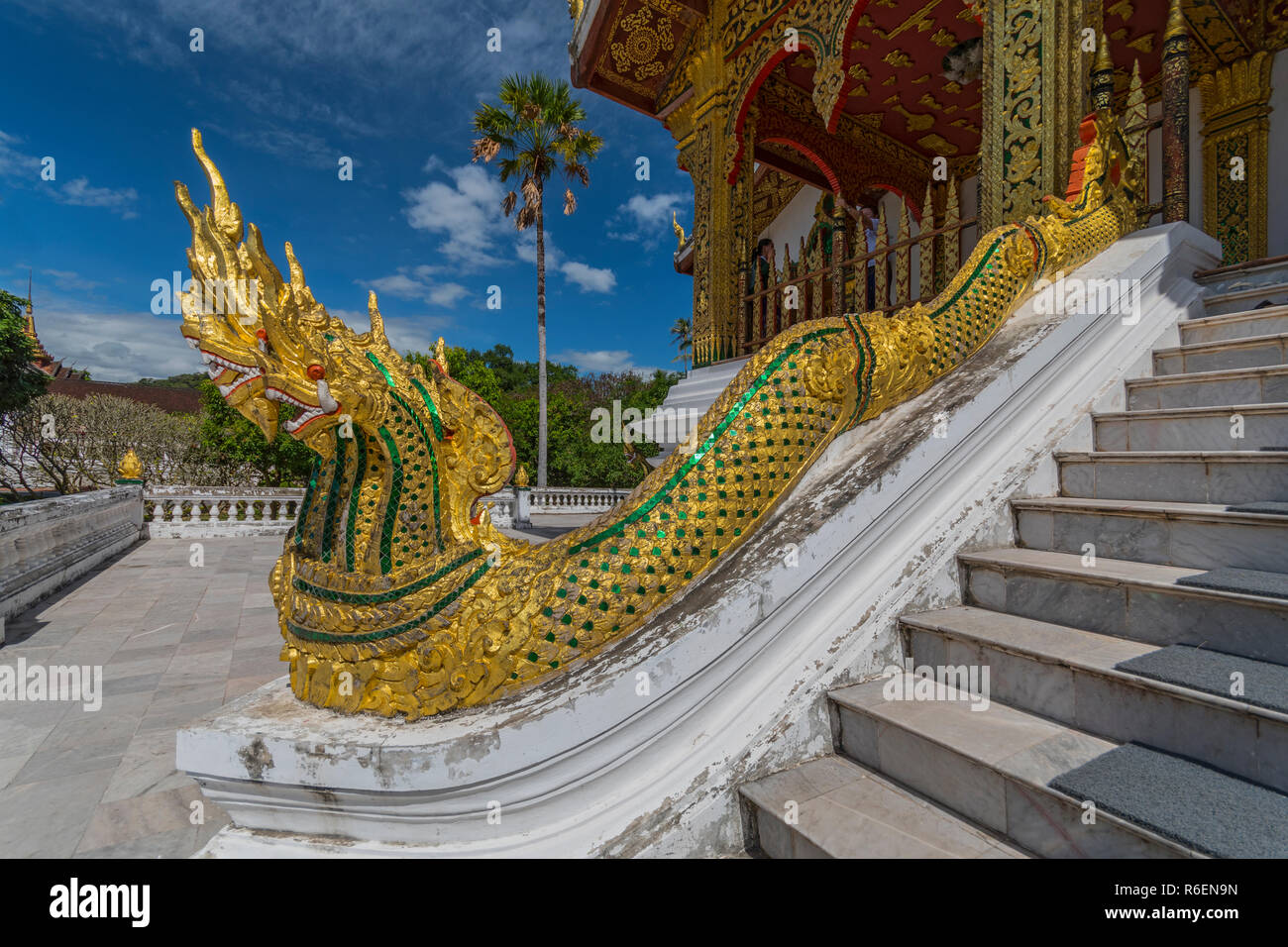 Golden Naga (King Cobras) Decorate Teh Stairs Of Haw Pha Bang (Or Palace Chapel) At The Royal Palace Museum In Luang Prabang, Laos Stock Photo