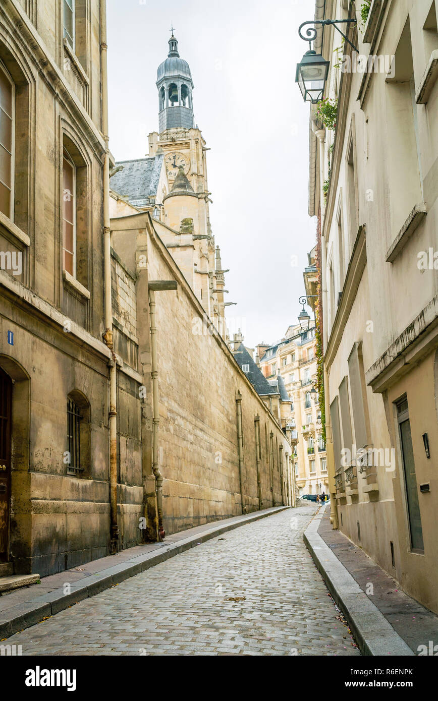 Paris quiet paved street and church Stock Photo