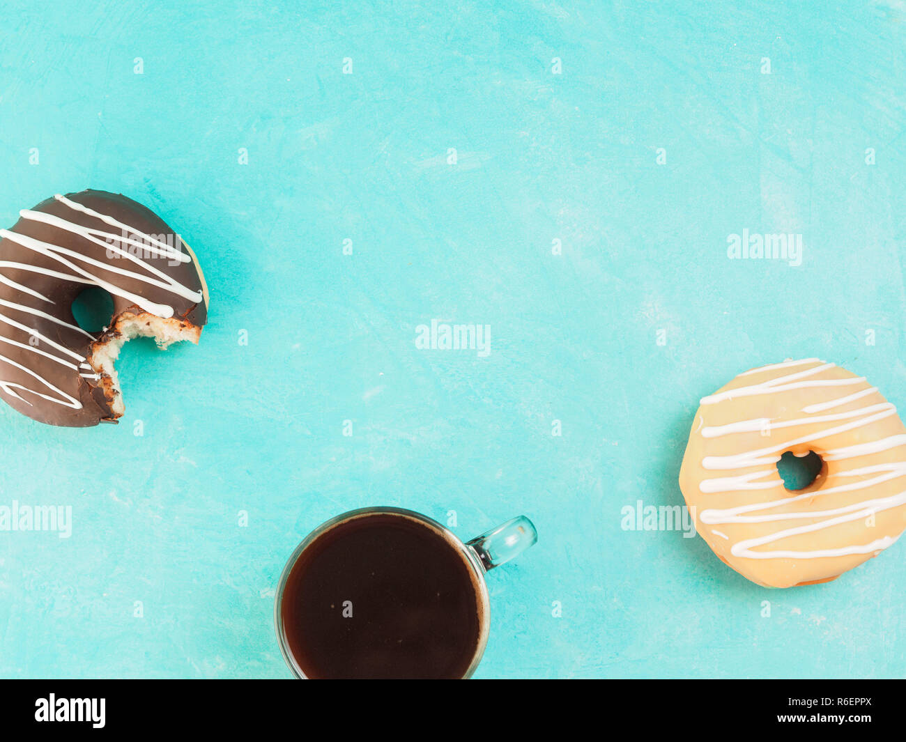 donuts on blue background , copy space, top view Stock Photo - Alamy