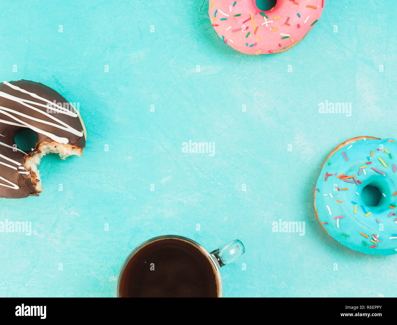 donuts on blue background , copy space, top view Stock Photo - Alamy