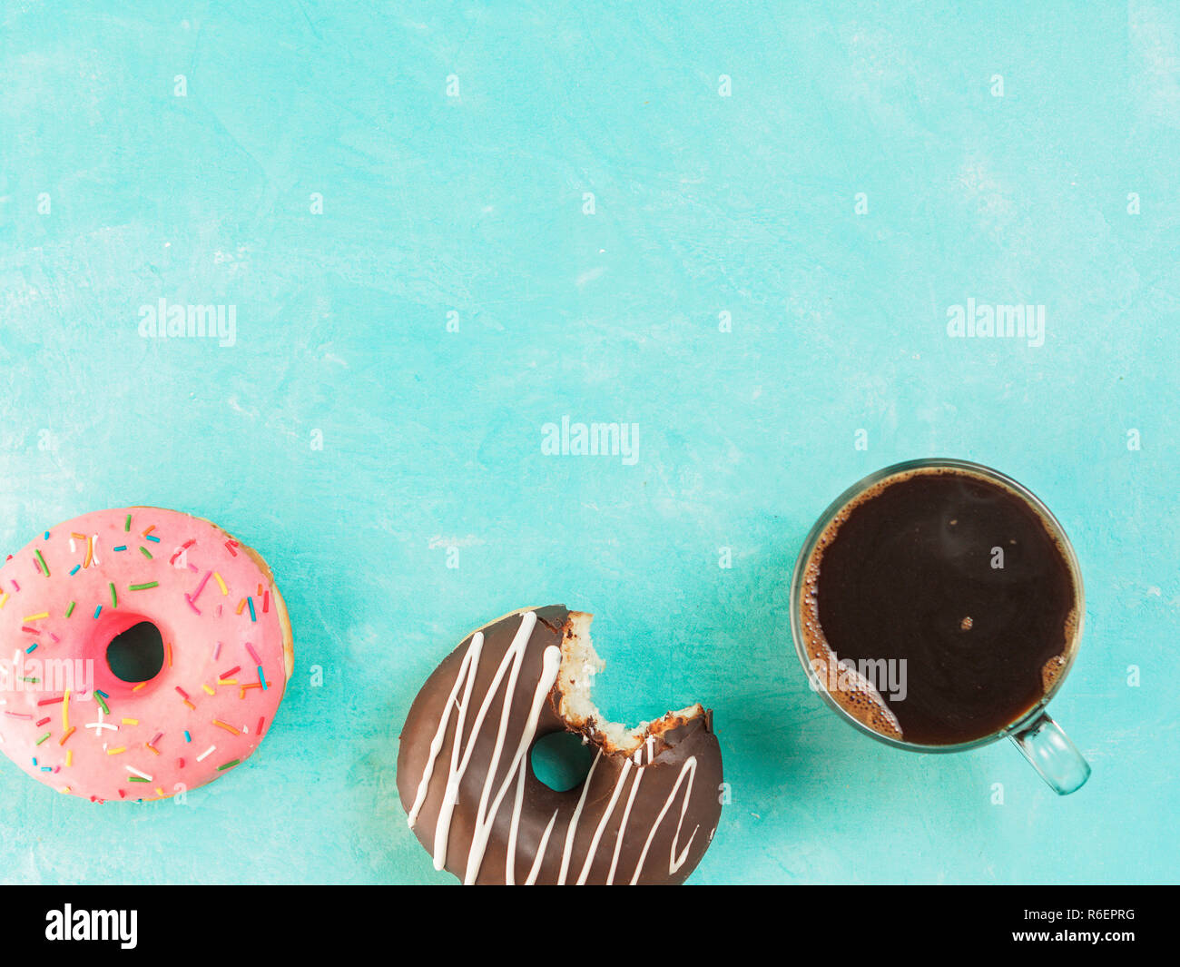 donuts on blue background , copy space, top view Stock Photo - Alamy