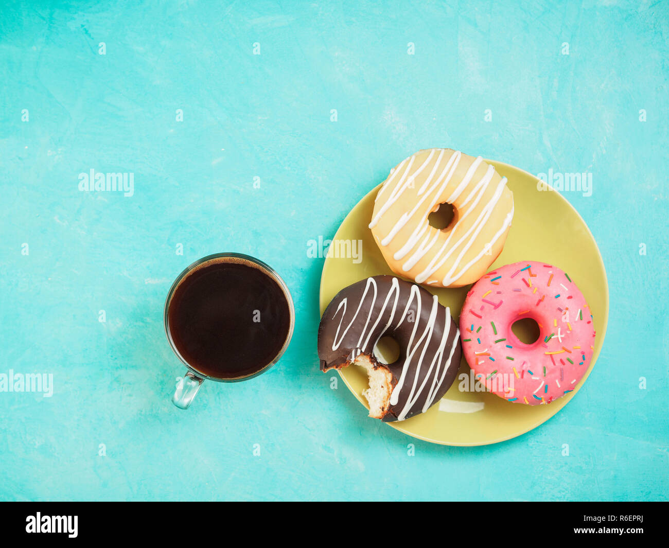 donuts on blue background , copy space, top view Stock Photo - Alamy