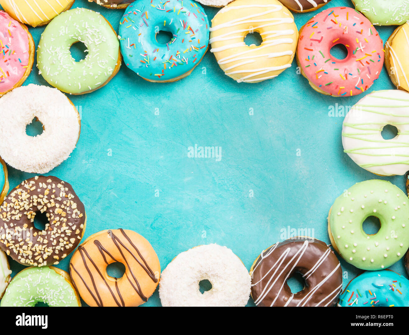 donuts on blue background , copy space, top view Stock Photo - Alamy