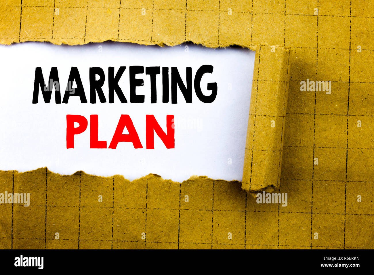 Word, writing Marketing Plan. Business concept for Planning Successful Strategy written on white paper on the yellow folded paper. Stock Photo
