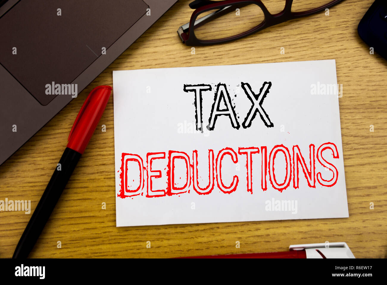 Handwriting Announcement text showing Tax Deductions. Business concept