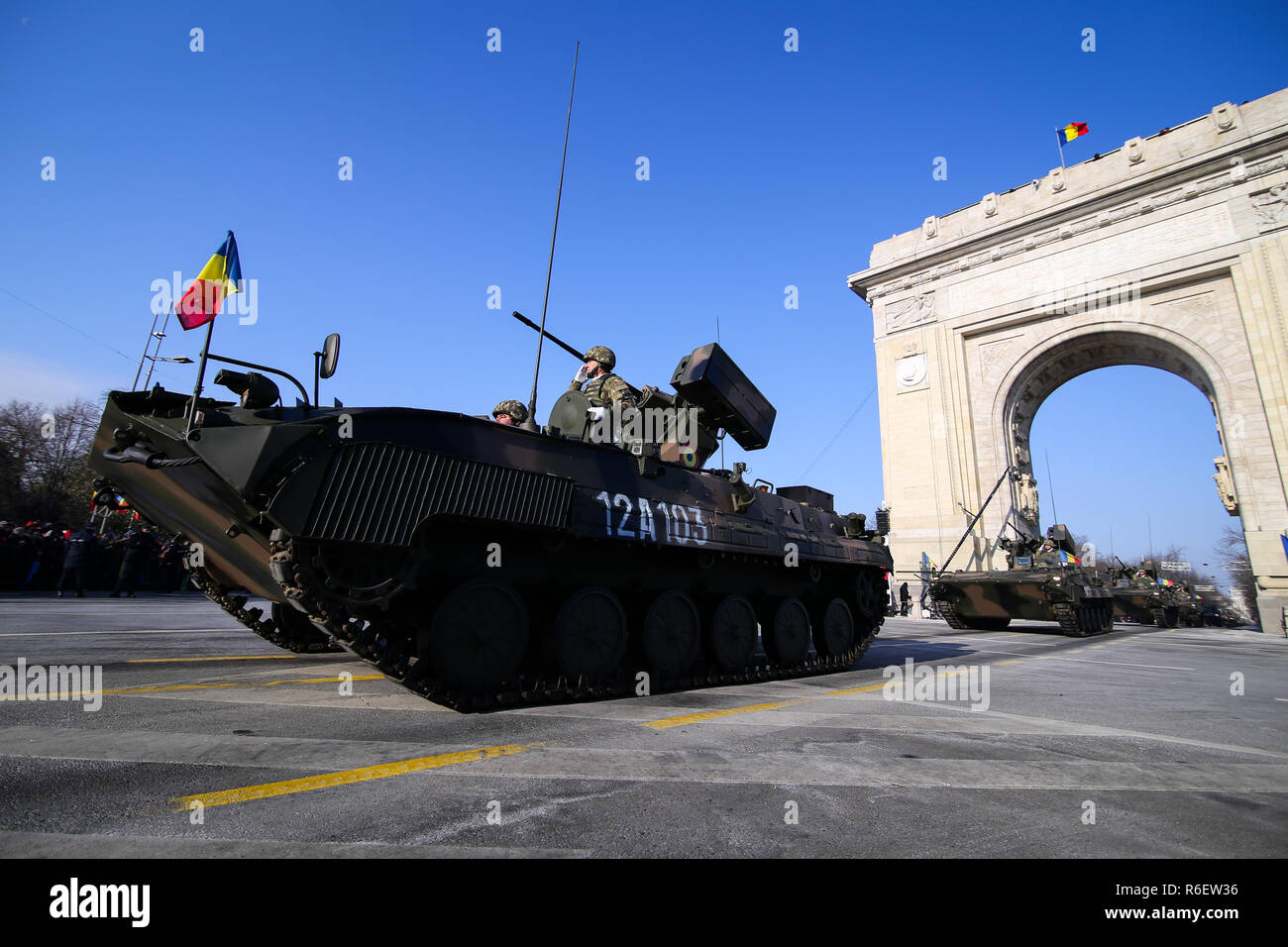 BUCHAREST, ROMANIA - December 1, 2018: MLI 84 M combat armored vehicle at Romanian National Day military parade passes under the Arch of Triumph Stock Photo