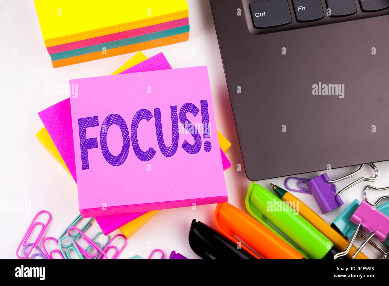 Writing text showing Focus made in the office with surroundings such as laptop, marker, pen. Business concept for Attention Success Concentrate Workshop white background copy space Stock Photo