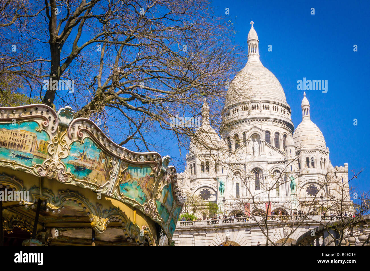 Sacre coeur and merry-go-round in Montmartre Stock Photo