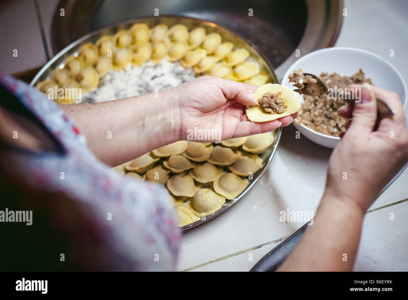 hand modeling dumplings at home in the kitchen Stock Photo - Alamy