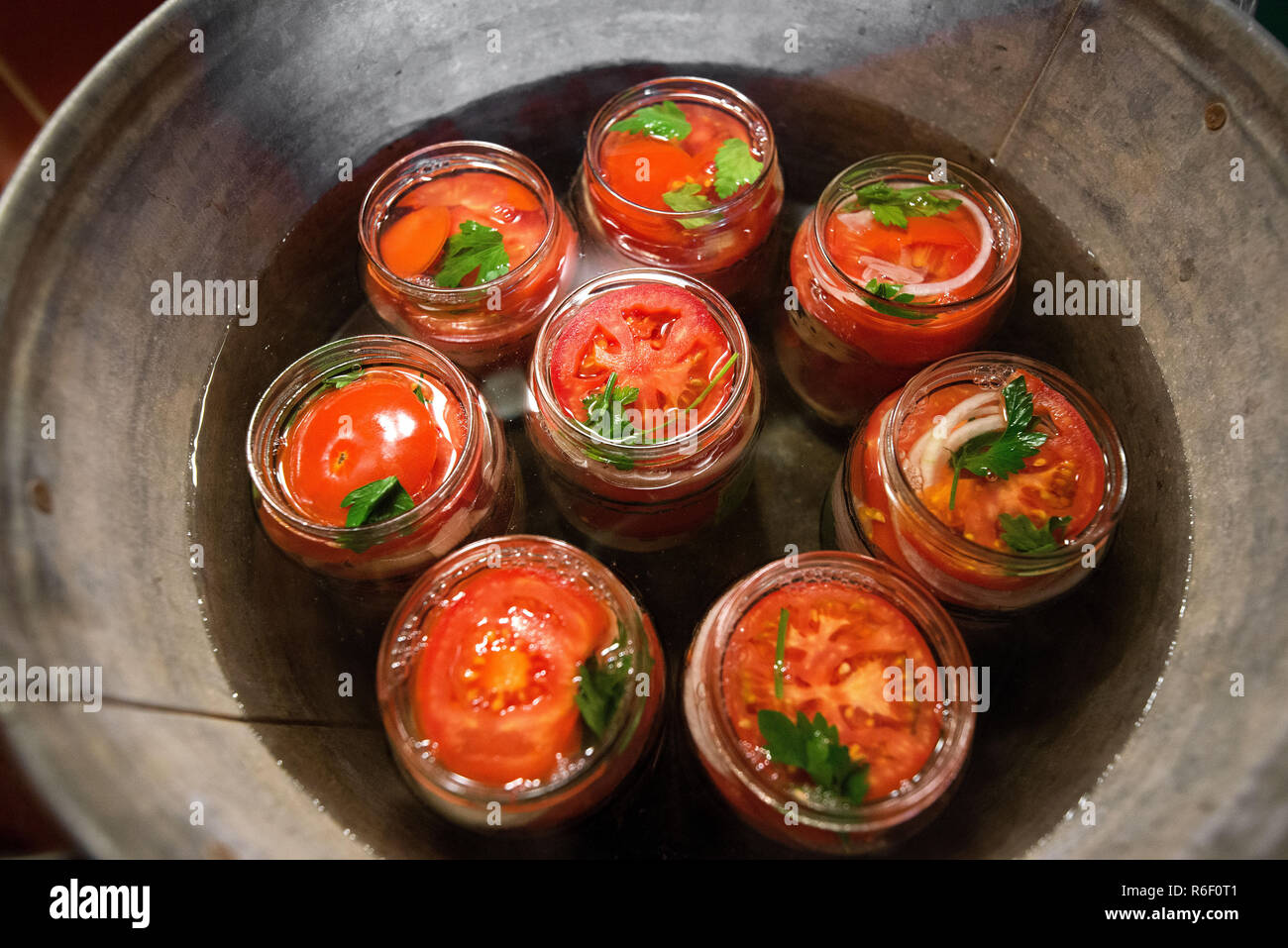 Canning fresh tomatoes with onions in jelly marinade. Conservation and