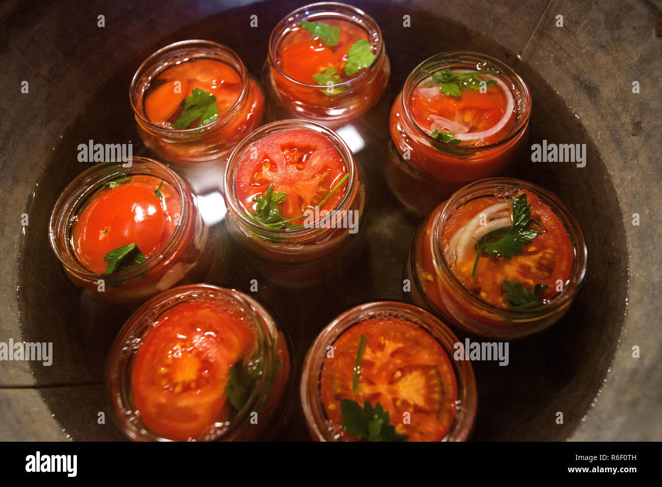 Canning fresh tomatoes with onions in jelly marinade. Conservation and