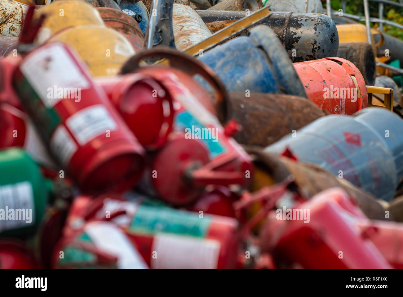 Old extinguisher and gas bottles on scrap yard Stock Photo Alamy