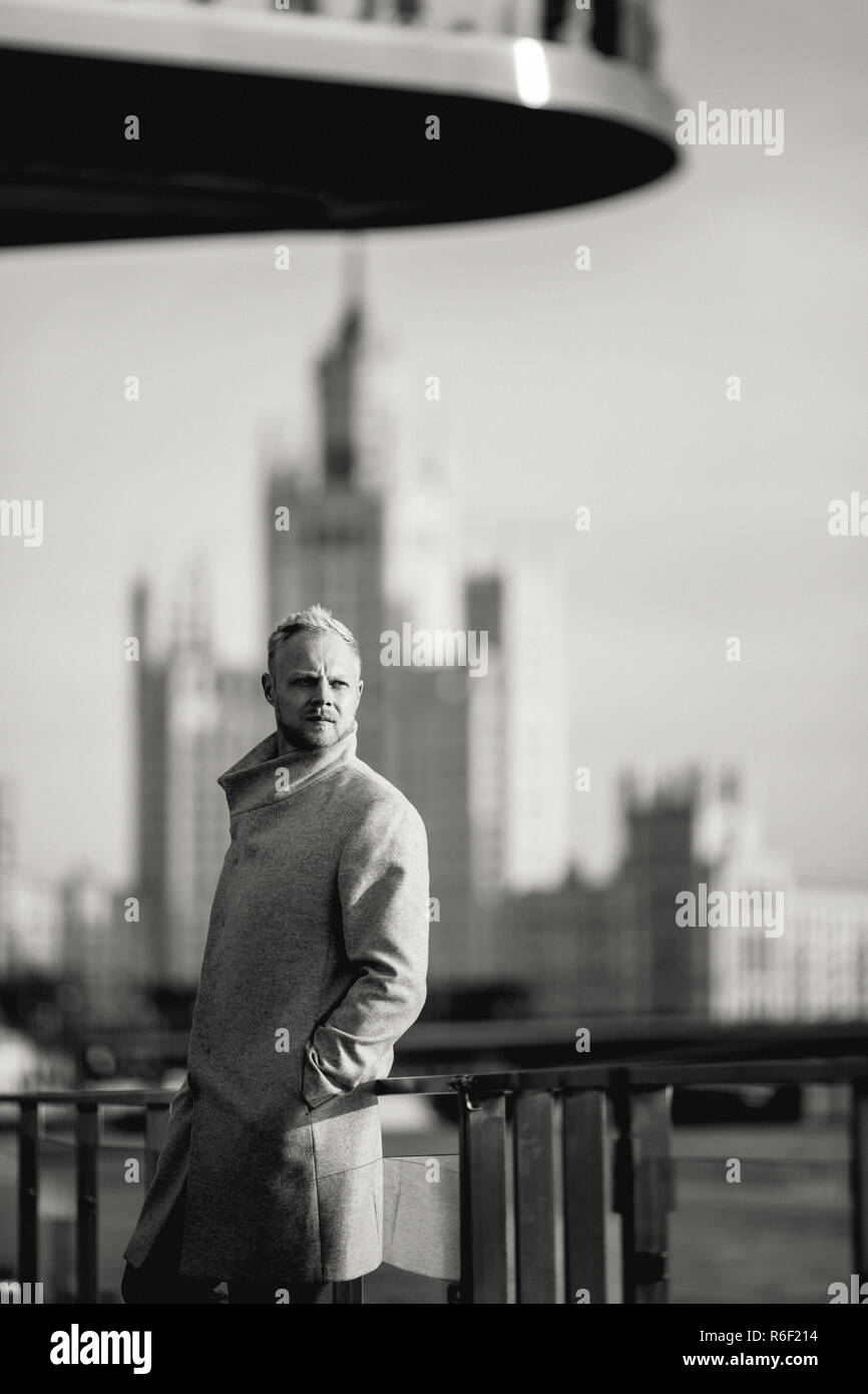Black and white photo of man in coat for walk Stock Photo